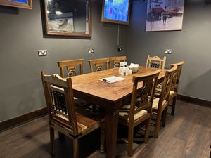 Big table seating downstairs   at Bio Cafe in Aberdeen