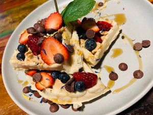 Waffle with peanut butter and mixed berries   at Bio Cafe in Aberdeen