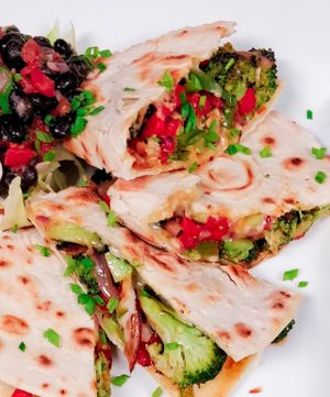Quesadilla including Broccoli, Roasted Red Pepper, Green Pepper, Red Onion, Vegan Red Pepper Cheddar, Black Bean Salsa at La Boca Wood Fired Pizzeria in Burlington