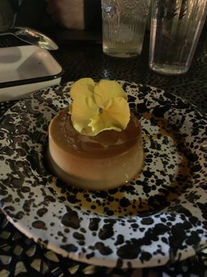 Vegan flan (don’t eat the flower lol it’s perfumed)   at Cielo Rojo in Takoma Park