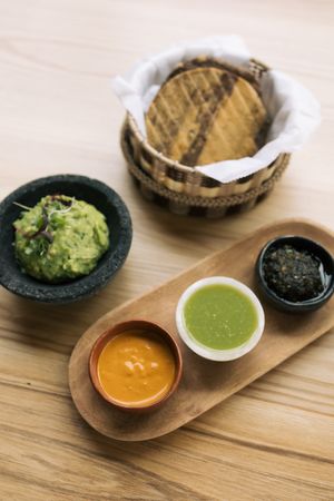Guacamole and tostadas with trio of salsas at Cielo Rojo in Takoma Park