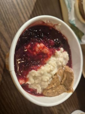 Almond milk ruby porridge with almond butter at STN - LEON in Stansted