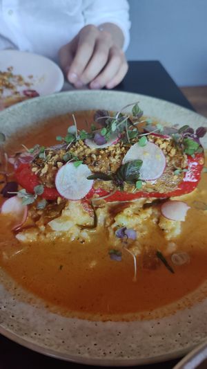 Banana peppers stuffed w shitaki mushrooms, bamboo, tofu and cashew cream, served on coriander mash and finished w kaffir lime and Penang curry at Yulli's in Byron Bay