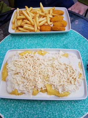 Polenta with cashew cream and grated cheese and Nuggets with fries at Level Up in Bucharest