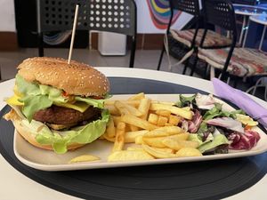 Smokey burger (29 lei) with salad and fries (9 lei)  at Level Up in Bucharest
