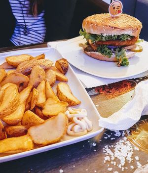 Double "cheese" burger and potato wedges at Level Up in Bucharest