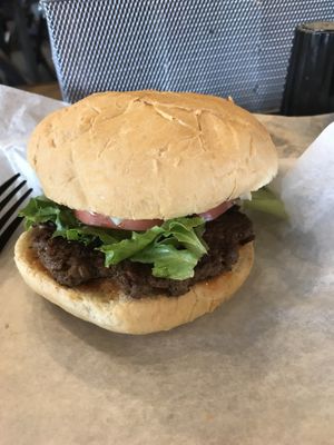 Impossible burger with tomatoes, onions and lettuce  at Brothers BBQ in Broomfield
