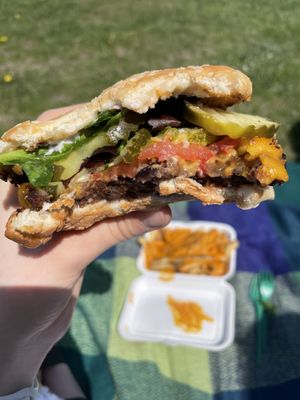 Black bean burger and cheese fries in the back ground at Totally Awesome Vegan Food Truck in Portland