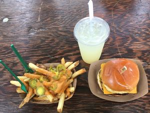 Black bean burger and jalapeño cheese fries and maple sweetened lemonade  at Totally Awesome Vegan Food Truck in Portland