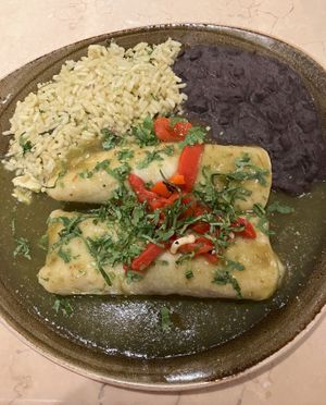 Enchiladas de Aquacate from the vegan menu. Avocado, poblano peppers & artichoke enchiladas topped with tomatillo sauce, cilantro & roasted red peppers. 2 thumbs up! at Cantina Laredo in Bloomington