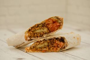 Tasty Roll - Tofu in batter, bbq sauce, smoked grilled sauce, fried onions, tomatoes, pickles, iceberg lettuce
 at Vega in St Petersburg