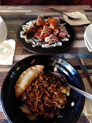 Fried mushrooms and black noodles with dumplings - both were delicious! at Cafe SIVA 카페 시바 in Seoul