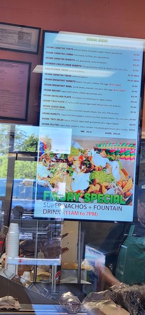 Vegan menu behind cashier. 😋 at Cruz Tacos in Murrieta