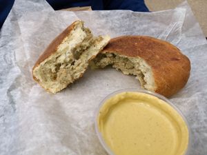Cheesy Sausage Breakfast Bun w/ jalapeno cheddar sauce at Rose Gold Coffee Company in Kalamazoo
