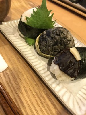 Vegan onigiri (lotus leaf, mushroom and soy meat one)  at Musubi Cafe - Gion Kamogawa in Kyoto
