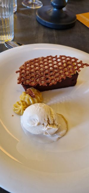 Rich chocolate torte with banana and passionfruit cream, tonka bean and rum ice cream, at Saorsa 1875 in Pitlochry