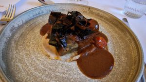 AUBERGINE pressed aubergine, cannellini purée, garlic confit tomato, red wine reduction & crispy aubergine skin at Saorsa 1875 in Pitlochry