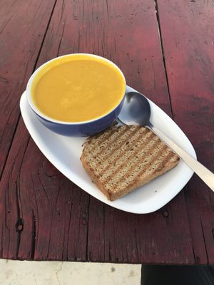 carrot orange soup and her amazing homemade bread at Lhamo's Croissant in Dharamshala