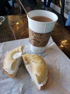 Rosemary bagel with tofutti and earl gray tea with almond milk. at Leroy's Bagels in Denver