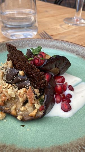 Roasted eggplant with salsa verde, fresh vegan yoghurt and chia crackers. An amazing and flavorful starter  at VanPlanten in Utrecht