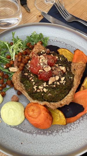 Main: pea-mint quiche with rainbow carrots, chickpeas, smoked almonds and citrus mayo. Very good portion size and taste  at VanPlanten in Utrecht