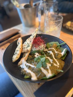 Palak tofu with crispy naan. Tasty, but a bit cold when served.  at VanPlanten in Utrecht