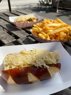 Bratwurst sausage on a pretzel bun with sauerkraut  at Vegan Brüder in Fort Lauderdale