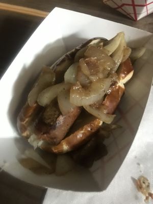Bratwurst sausage with sauerkraut and onions  at Vegan Brüder in Fort Lauderdale