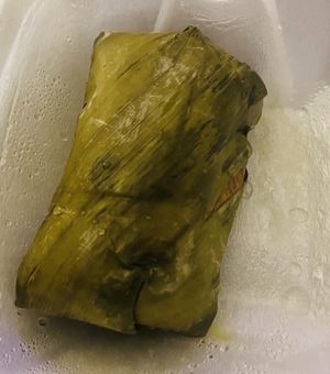 Mung bean cake wrapped in a banana leaf  at Wheel of Life in Irvine