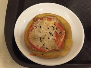 Small vegetable pastry with vegan cheese, tomato and zucchini   at Lyublyu i Blagodaryu in Yekaterinburg