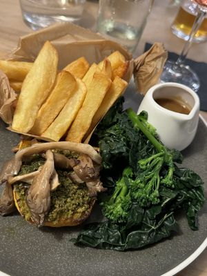 Maple glazed butternut pave with herb crumb, oyster mushrooms, Dijon mustard sauce, tenderstem broccoli and proper chips  at The Crown Inn in Broughton