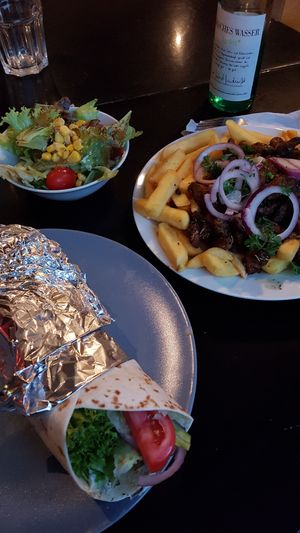 Gyros wrap & gyros on fries. at Trash Chic in Cologne