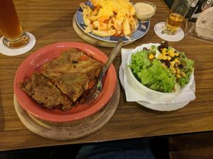 Pumpkin lasagna, salad, chili-cheese fries at Trash Chic in Cologne