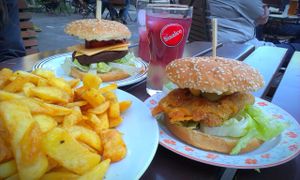 Burgers and big plate full of fries at Trash Chic in Cologne