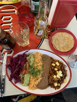‘plato’ with planted pastor, rice, cabbage, guacamole, beans and pineapple. served with tortillas   at La Taqueria - Kreis 4 in Zurich