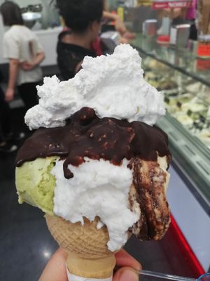 Avocado, coconut and Nutella dipped into chocolate and topped off with cream at Gelateria Brivido in Rome