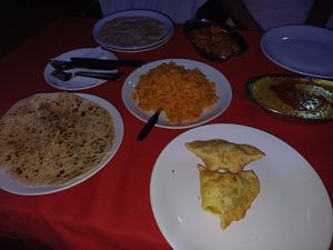 Veg samosas, tarka dal, vegetable jalfrezi, masala rice, peshwari naan & chapatis at Lonely Planet in Kovalam