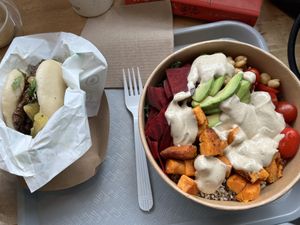 Warm healthy bowl w/ quinoa beets chickpeas avocado and sweet potatoes, tofu skin bao bun  at Spring Cafe in New York City