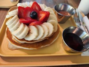 Pancakes with fruit, syrup, and sweet butter at The Cocinita in Miami