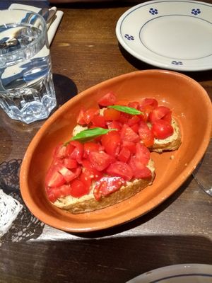 BRUSCHETTA CLASSICA: Toasted homemade bread with fresh torpedino tomatoes & garlic olive oil  at Terra Rossa in North London