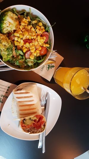 salad and vegan wrap, fresh orange juice at Salad Planet in Valencia