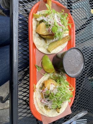 Vegetarian tacos with side of beans  at Papi's Tacos in Baltimore