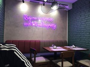 Neon sign inside at Veggies in Tirana