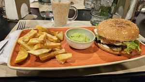 Vegan burger with guacamole and tropical smoothie at Veggies in Tirana