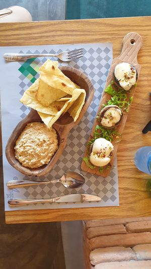 Stuffed mushrooms (cheese) and arabic pitas + hummus. The pitas, I think, would've been better soft than crispy. at Veggies in Tirana