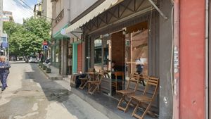 The sign is super small and only visible to one side, I had to check the menu to actually know what the place was. at Veggies in Tirana