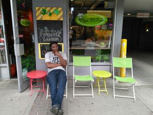 Chef Peter McKenzie of Veggie D'Light sitting outside his spot.  at Veggie D'Light in Toronto