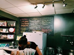 the menu and kitchen in Veggie D'light at Veggie D'Light in Toronto