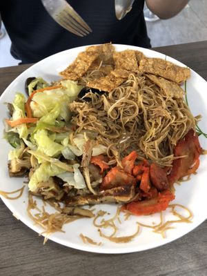 Fried bee hoon with side dishes  at Taste of Vegetarian in East Singapore