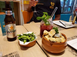 Eggplant starter, edamame, hibiscus ice tea with orange at Yasai Natural Sushi in Rio De Janeiro